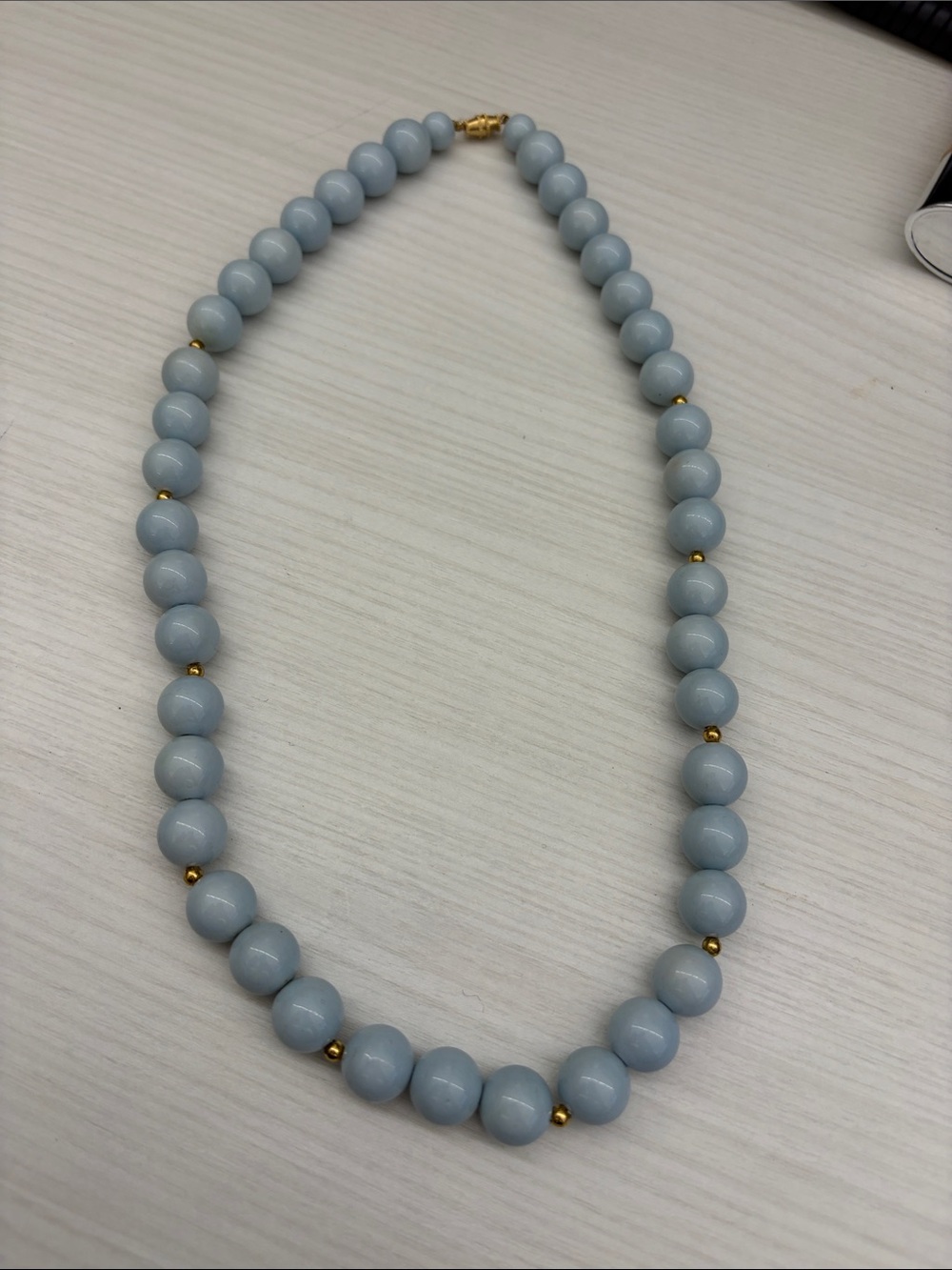 Elegant Light Blue Beaded Necklace with Gold Accents
